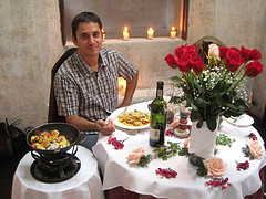 Man, dinner table set for two